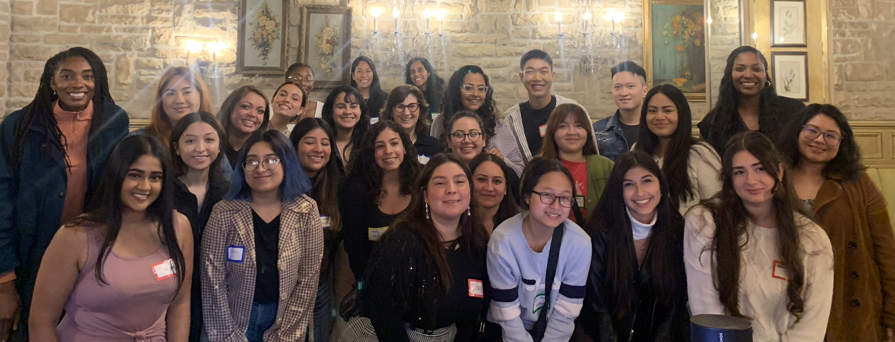 Smiling, diverse young women at restuarant