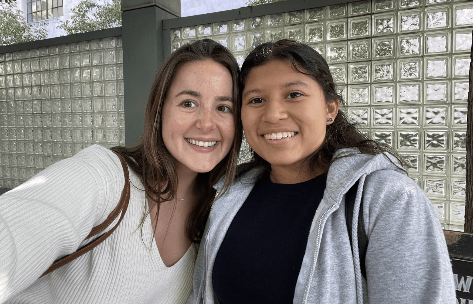 Latina woman and two teens in restaurant